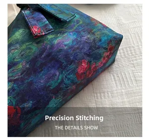 Detailed close-up of precise stitching and oil painting floral pattern on the woven bag