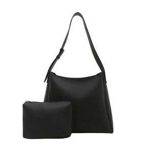 Large black minimalist tote bag with matching pouch and adjustable shoulder strap