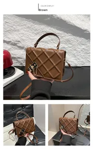 Close-up of brown quilted crossbody bag with gold-tone twist lock and stylish chain strap