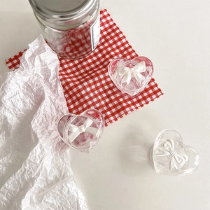 Minimalist transparent heart-shaped storage box with 3D white bow tie decoration