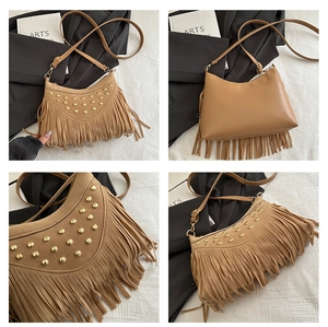 Detail view of brown suede saddle bag with golden studs and long bohemian tassels