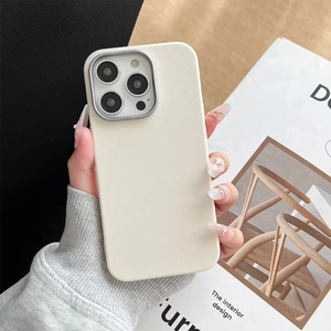 Minimalist cream leather iPhone 16 Pro Max case with protective silver metal camera ring