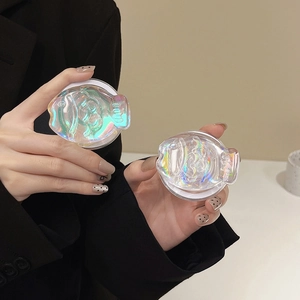 Detail of colorful iridescent fish-shaped magnetic phone grip with 3D resin texture