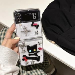 Detail showing 3D cat, bone and star decorations on a clear Samsung Z Flip case
