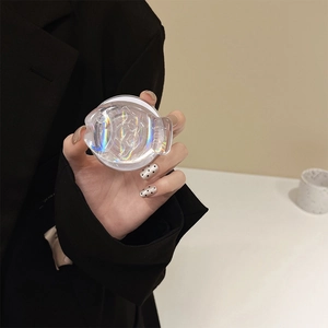 Iridescent fish-themed magnetic clear phone socket grip shown held in hand