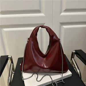 Minimalist wine red glossy leather triangle hobo bag with silver chain strap for women