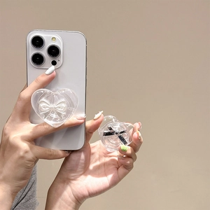 Detailed view of clear heart phone socket with a silver bow tie on a smartphone