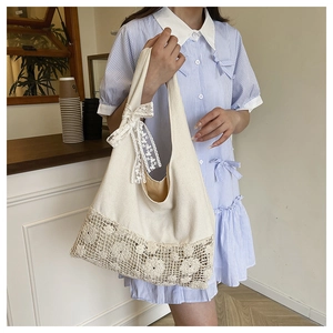 Floral crochet canvas shoulder bag with lace bow for women in casual cafe setting