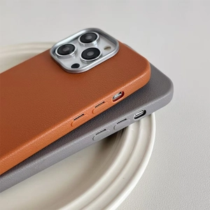 Close-up of litchi grain leather phone case with metallic camera ring and precise side buttons
