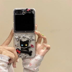 Close-up of Galaxy Z Flip case with 3D cat, silver stars, and Y2K aesthetic decorations