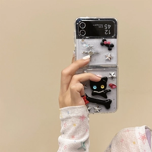 Macro shot of transparent glitter phone case with cute cat and star 3D charms