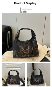 Detail of vintage floral embroidery and sturdy buckle on this black crossbody bucket bag
