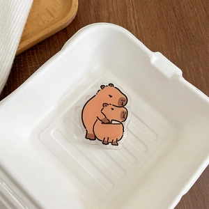 Close-up of cute acrylic Capybara phone socket holder with double stacking animal design