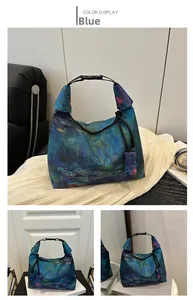 Detail view of the water lily embroidery on blue Chinese style bucket bag