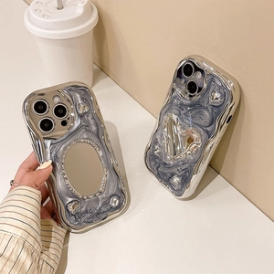 Silver mirror heart and oval phone case for iPhone 16 in marble grey silicone