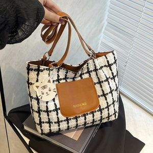 Black and white plaid tweed tote bag with leather straps and cute tiger charm