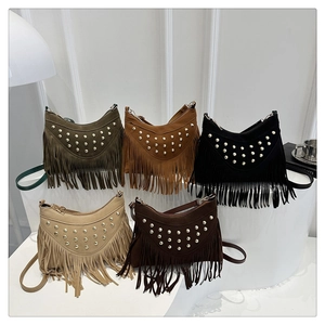 Collection of matte suede crescent bags with metal studs and long fringe tassels