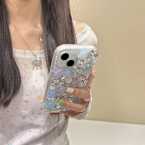 Luxury iPhone case with blue and purple roses, silver butterflies, and rhinestones