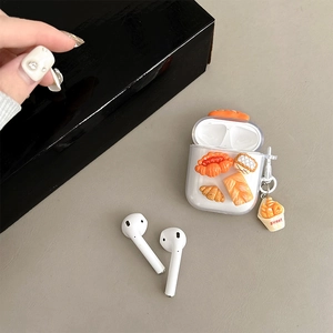 Detailed macro view of Airpods case featuring 3D realistic bread charms and sweet pendant