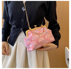 Pink sequin evening bag with gold chain and vintage clasp worn by model