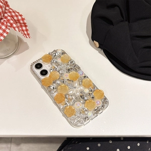 Detail of luxury Samsung case featuring yellow resin roses, pearls and sparkling crystals