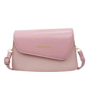 Pink minimalist crossbody bag with asymmetrical flap and textured woven leather finish