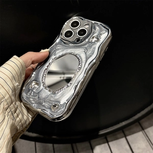 Close-up of silver wavy iPhone case with oval mirror and sparkling rhinestone details