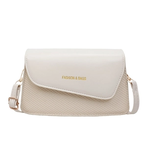 Minimalist cream white square crossbody bag with textured patchwork and gold lettering
