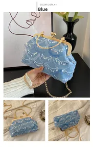 Detailed shot of blue sequin evening bag with gold chain and vintage metal clasp