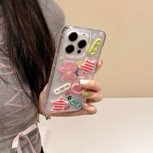 Close-up of a clear glitter iPhone 16 Pro case with 3D star and bear decorations