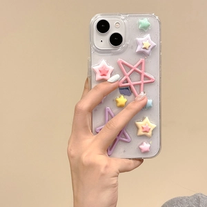 Close-up of a clear glitter phone case decorated with colorful 3D star ornaments