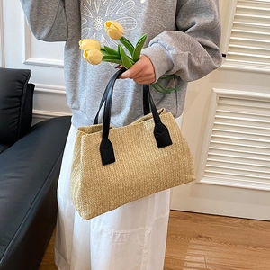 Elegant casual Korean style woven straw tote bag with black handles for spring outings