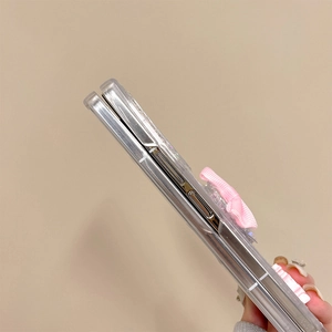 Detailed side view of clear phone case with pink bow and precise cutouts for foldable phones
