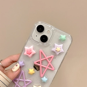 Close-up of clear iPhone case featuring colorful 3D stars and silver glitter