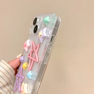 Detailed macro view of a transparent iPhone case featuring 3D colorful glittery resin stars