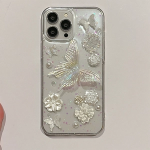 Detailed view of 3D pearl flowers and iridescent butterfly on clear iPhone case
