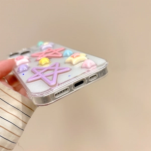 Detail view of a clear iPhone case decorated with glitter and colorful 3D resin stars