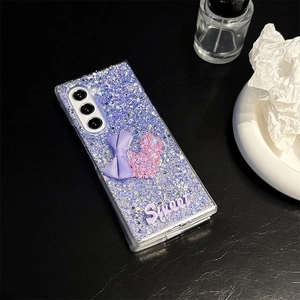 Detail view of purple glitter Samsung Z Fold case with 3D bow and Sweet lettering
