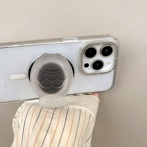 Support MagSafe translucide en forme de poisson sur smartphone blanc pour bureau