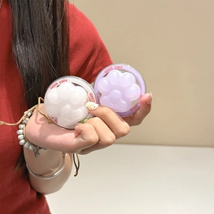 Close-up of cat paw phone grips in white and purple with Good Luck text details