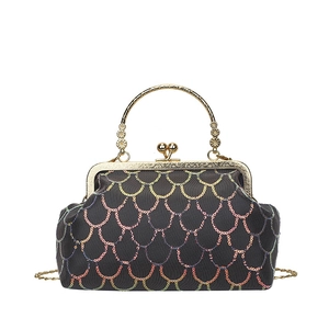 Elegant evening clutch bag with iridescent sequin patterns and ornate gold metal handle