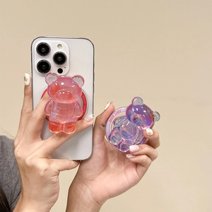 Détail du support téléphone ours laser rose et violet avec gravure Good Luck sur la base