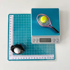 Miniature sports phone stand showing size and weight measurement on a scale