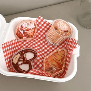 Cute acrylic bread phone sockets set featuring croissant and latte on checkered cloth