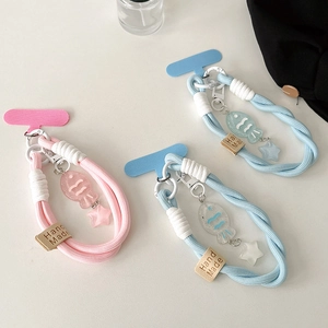 Handmade woven Taiyaki fish charm phone strap and keychain in pastel colors on white background