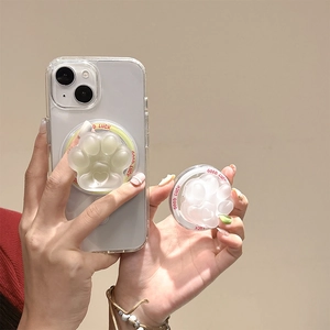Transparent cat paw phone grip with Good Luck text on a creamy white minimalist background
