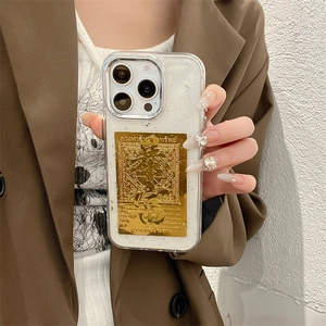 Detail of transparent iPhone case with glitter foil and golden Buddhist scripture plaque