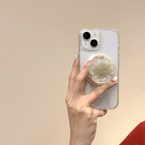 Close-up of cat paw phone grip with Good Luck text and retractable airbag stand