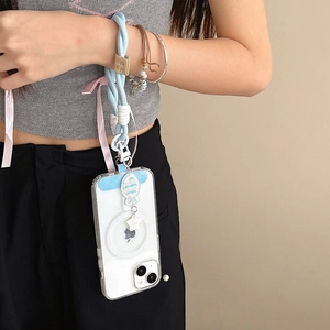 Detail of blue woven phone strap with wooden handmade tag and fish charm