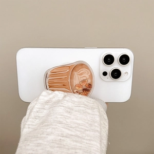 Cute coffee cup shaped phone grip with mini coffee beans and latte art on white smartphone